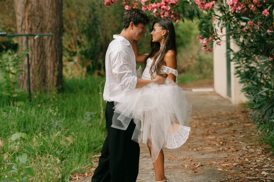 Bride And Groom Facing Each Other Outdoors