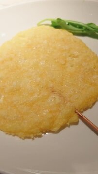 Crispy parmesan cheese frico appetizer on plate
