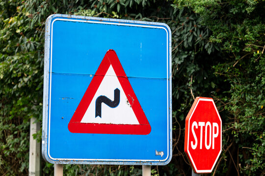 Road warning triangle and stop sign