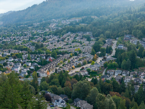 Aerial View of Suburban Neighborhood and Tree‑Covered Hills in Chilliwack, British Columbia