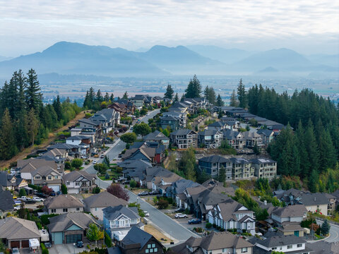 Suburban Neighborhood Overlooking Foggy Valley and Mountains in Chilliwack, British Columbia, Canada
