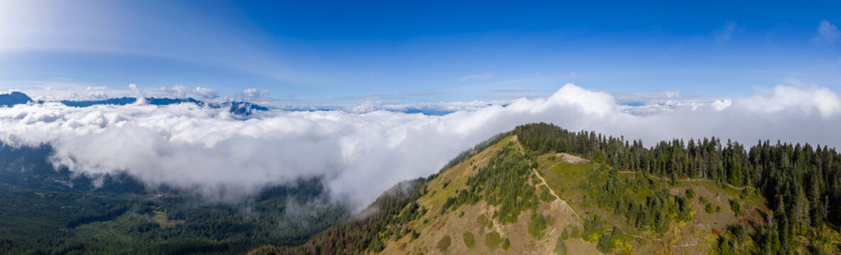 Panoramic Mountain Ridge Overlooking Clouds and Forest Near Chilliwack, British Columbia, Canada