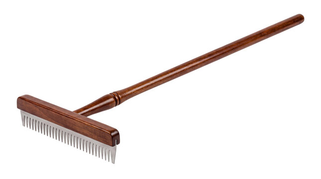 Traditional wooden wool rake with steel teeth, professional fiber processing tool for wool carding, handcrafted wooden handle wool comb isolated PNG with Transparent Background