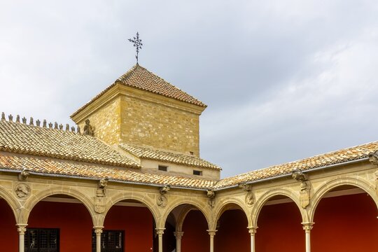 Casa de las Torres, a Renaissance palace in &Uacute;beda, featuring its historical Plateresque architecture with arcades and a central tower under a cloudy sky