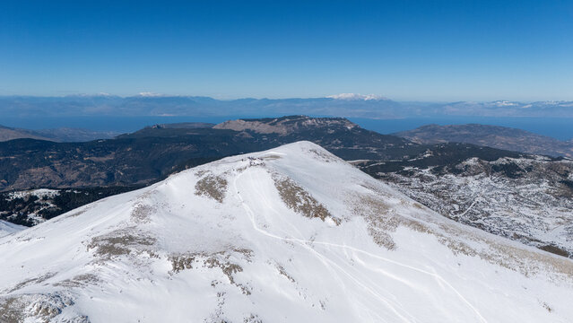 Aerial view of snowy Mount Zireia summit in Corinthia, Greece, Mount Kyllini