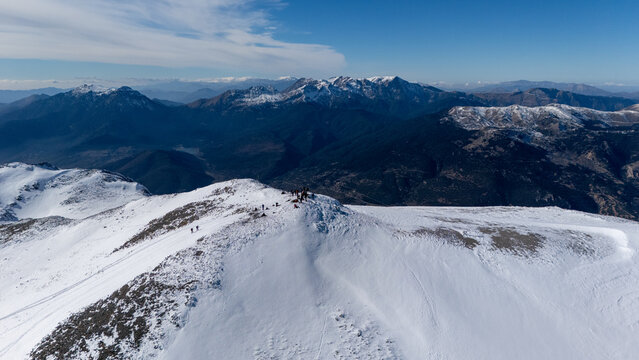 Aerial view of snowy Mount Zireia summit in Corinthia, Greece, Mount Kyllini