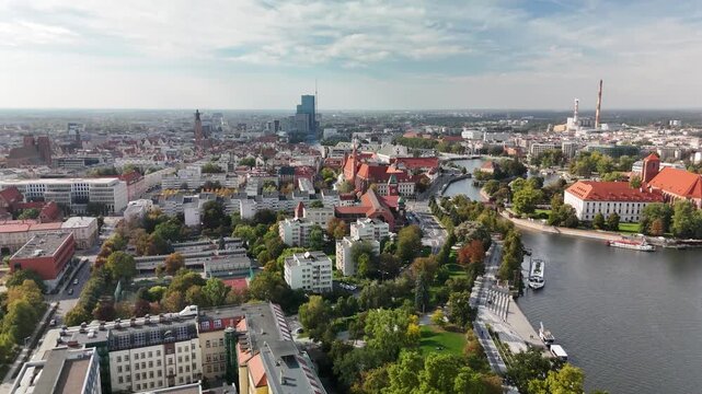 Aerial panorama of Wrocław city with Oder river, historic buildings and Sky Tower in early autumn, Poland