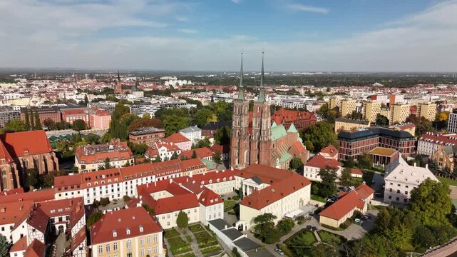Wrocław Cathedral twin spires and Ostr&oacute;w Tumski rooftops on a sunny day, Poland