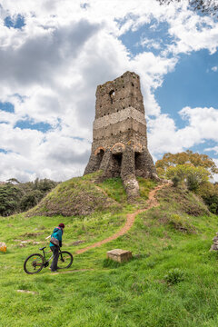 Woman Taking a Break from riding Via Appia Antica by Torre Selce, Rome