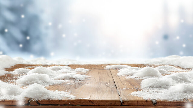 Winter product mockup with copy space &ndash; snowy mountain landscape and product placement. Clean space for product placement surrounded by fresh snow. Winter template for commercial campaigns.