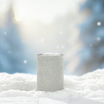 Winter mockup composition with clean space for product placement surrounded by fresh snow. Blurred snowy mountain landscape in the background. Clear copy space for product, logo, text or advertising.