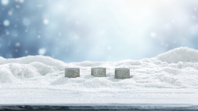 Winter mockup composition with clean space for product placement surrounded by fresh snow. Blurred snowy mountain landscape in the background. Clear copy space for product, logo, text or advertising.