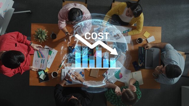A business team collaborates on cost reduction strategies during a meeting, surrounded by data charts and insights on performance and growth. Raster