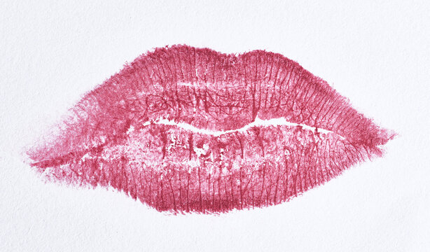 Textured imprint of female lips with bright pink lipstick, detailed skin microrelief
