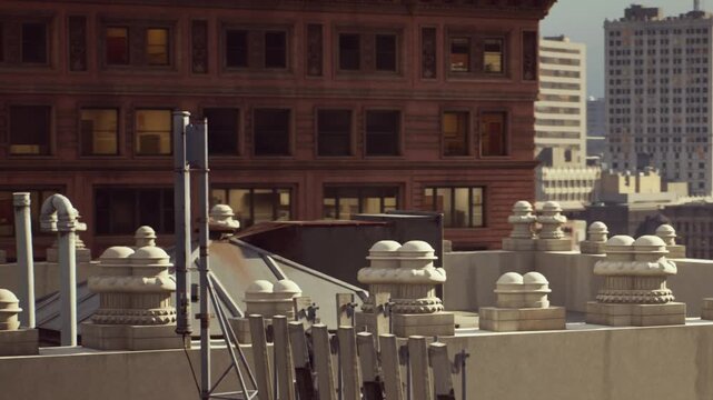 In a vibrant city, a stunning skyline showcases ornate building tops under a clear sky. The lively streets pulse with energy, harmonizing urban life and architectural beauty.