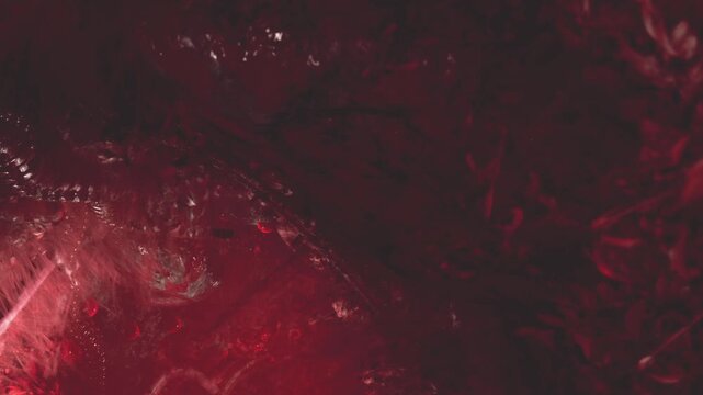 A mesmerizing display of deep red colors blends with intricate textures, evoking emotions. This captivating scene draws the eye and sparks imagination with its organic patterns.