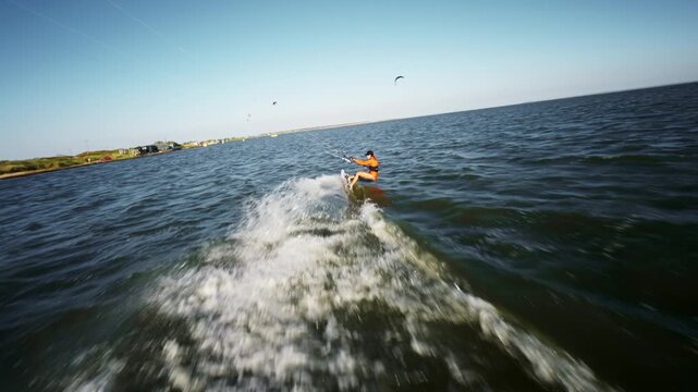 Kitesurfer Riding Wave In Open Water Aerial View