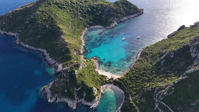 Aerial view of the turquoise Porto Timoni twin beaches on the coast of Corfu Greece