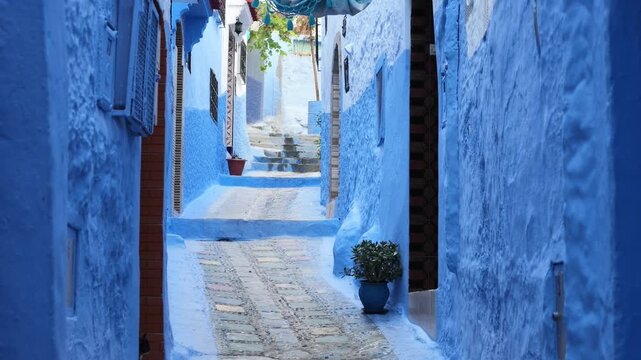 tilt up view of ancient Medina blue town alley in Chefchaouen, Morocco.