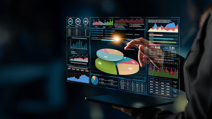 Futuristic Data Analysis with Interactive Graphs and Pie Charts Displayed on Transparent Screen in Modern Office Environment Fluxor. © InfiniteFlow