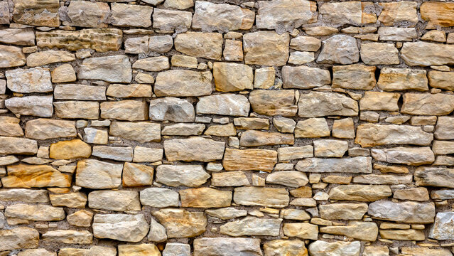 Rustic old stone wall background texture 
