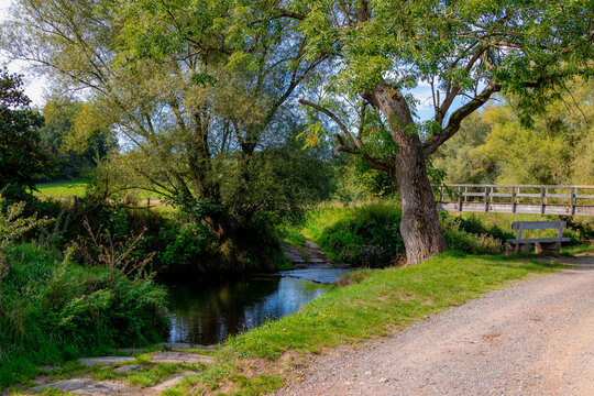 Autumn landscape, Terrain hilly countryside in Zuid-Limburg with wooden bridge, bench and trees along small river kleine Geul, Epen is a village in south of the Dutch province of Limburg, Netherlands.