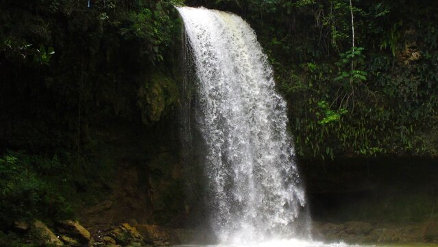 Tropical waterfall framed by dense Dominican Republic forest