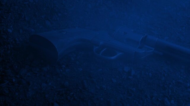 Six Shooter On Ground With Smoke Rushing Over At Night