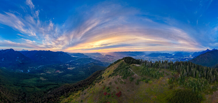 Panoramic Sunset Over Chilliwack Valley From Mountain Ridge With River and Forest Peaks