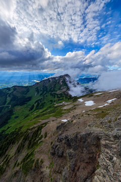 Dramatic Mountain Summit With Cloudscape and Sun Rays Over Valley Near Chilliwack BC Canada