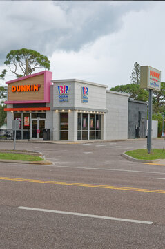 Exterior view of a Dunkin' and Baskin-Robbins combo shop Editorial Use Only September 30,2026 Gulfport, FL USA on a suburban street, showing bright signage, parking lot and entrance &mdash; ideal for concep