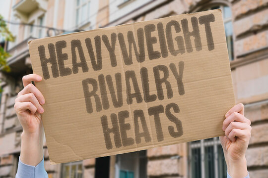 "Heavyweight rivalry heats" Division rivals escalate verbal hostility steadily. HEAVYWEIGHT. RIVALRY. HEATS. BOXING. FANS.