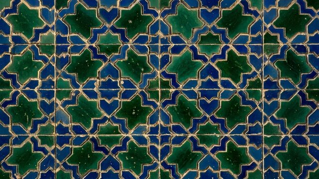 Full frame background texture of traditional Moroccan zellige mosaic ceramic wall tiles with green and blue geometric star pattern