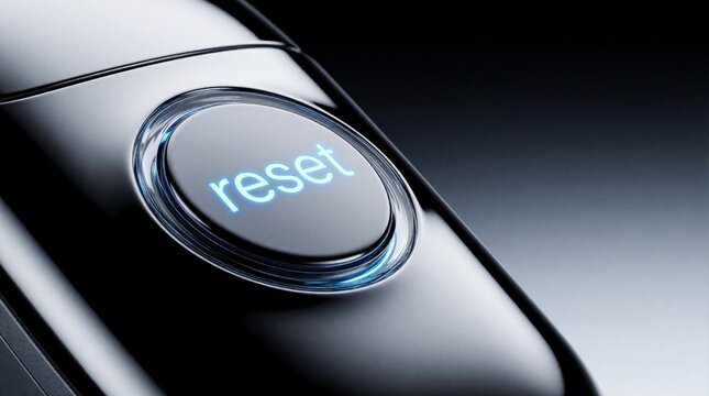 Close up of silver electronic device with glowing blue reset button. Metallic surface reflects cool neon light. Modern tech gadget features illuminated control panel for system reboot factory