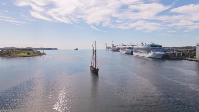 Aerial views of a sailing ship navigating Halifax harbor in Nova