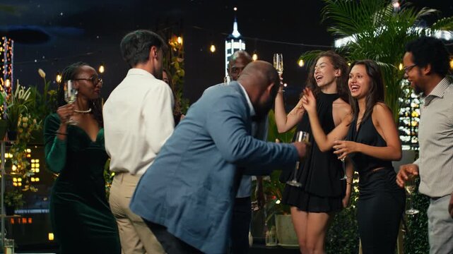 Cheerful friends dancing during upscale party
