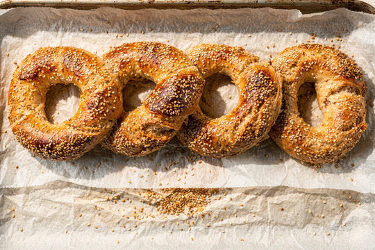 Freshly Baked Sesame Bagels on Parchment Paper