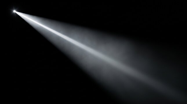 A bright white light beam extends diagonally across a dark background