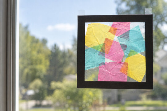 Colorful Tissue Paper Suncatcher Taped to a Window