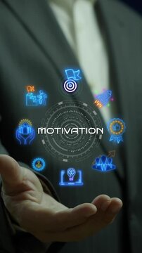 Businessman open hand vertical shot supporting glowing motivation text hub with ambition icons. Inspiring workplace employee empowerment, ambitious leadership drive, and goal achievement concept.