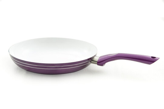 Purple frying pan with side stripes isolated on white background