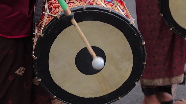 Close-up of Gendang Beleq Drum Being Struck in Traditional Indonesian Performance