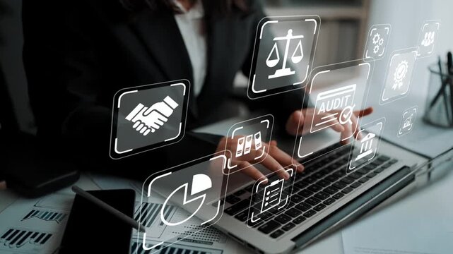 Business professional working on laptop with digital icons depicting legal, financial, and auditing concepts in a modern office environment Gluon.