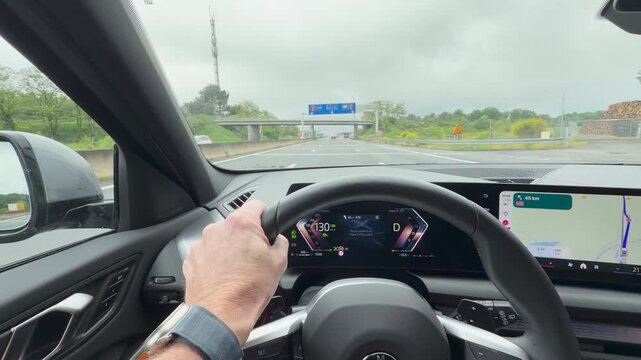 Hands on Steering Wheel Driving on French Highway