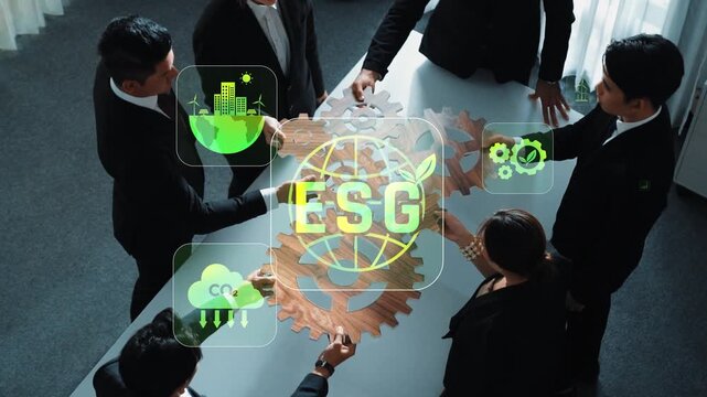 Diverse professionals collaborate in a modern office, focusing on ESG principles for sustainability and corporate responsibility. A dynamic meeting fosters innovative ideas. Raster