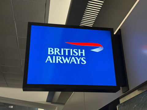 British Airways logo on a wall-mounted digital display inside San Francisco International Airport - California, USA - September 4, 2026