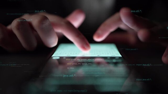 A close-up view of hands interacting with a smartphone in a dimly lit space, showcasing glowing text and coding symbols that emphasize the theme of technology. Xenic