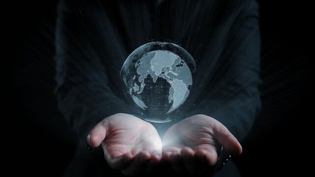 A person holding a glowing globe that displays various languages, representing global communication and cultural diversity in a digital world. Qubit