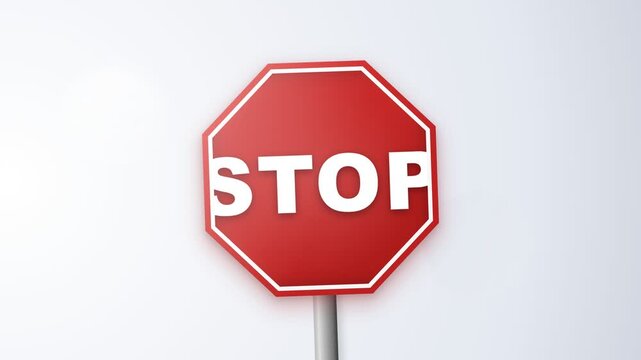 A red octagonal stop sign with white lettering against a light background