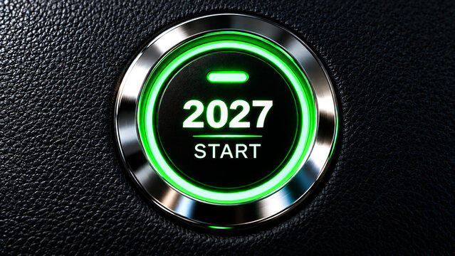 Glowing green start button featuring the numbers twenty twenty seven for new year concepts.